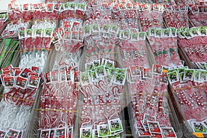 Red and white martenitsi on outdoor market for martenici on the street in Sofia, Bulgaria on Feb 8, 2016.