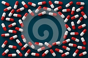 Red and white medicine capsules dangerous pill are spread on a dark blue background.