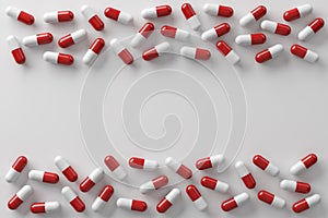 Red and white medicine capsules dangerous pill are spread on a white background.