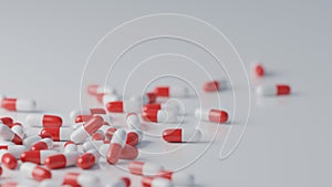 Red and white pills on white background. Pharmaceutical industry, medical treatment, presciption drugs concept. Digital 3D render.