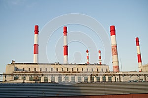 Red and white pipes of a city boiler room, heating system