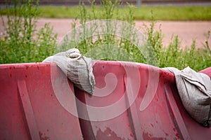Red and white plastic barriers blocking the road.
