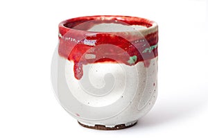 Red and white raku cup photo