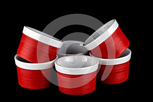 Red and White Ramekins Isolated on Black
