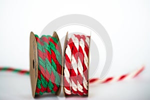 Red/White and Red/Green Twine Ribbons on white background