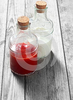 Red and White Sauces on Glass Jars