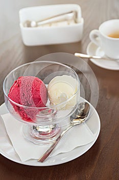 Red and white scoop of ice cream. Espresso coffee cup and sugar bowl with sugar