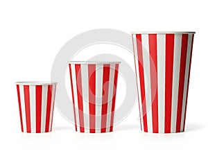 Red and white striped cups isolated on white background