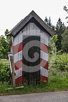 red and white striped guard house