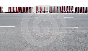 Red and White Striped Road Barricades Isolated on White Background