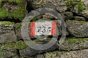 Red And White Stripes Trail Mark On Volcanic Rock In Etna Park, Sicily