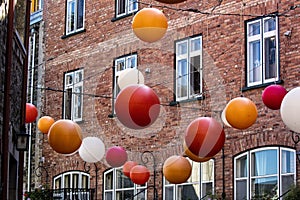 Red white tan and white decorative ball lamps inside Quebec City