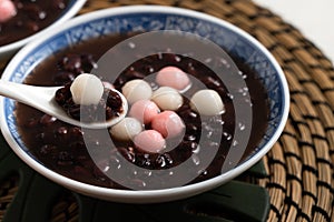 Red and white tangyuan with red bean soup photo