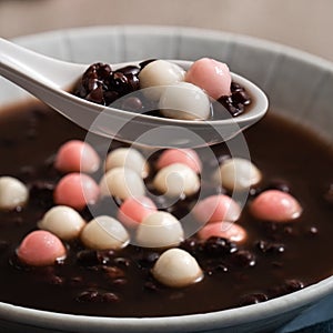 Red and white tangyuan with red bean soup