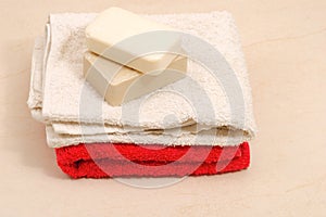 Red and white towels and honey