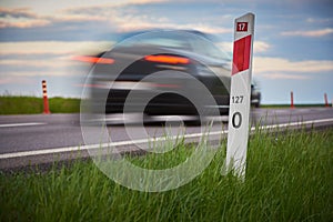Road bollard on a busy road