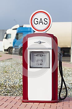 Red and white vintage gasoline fuel pump