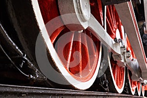 Red and white wheels of the old classic steam locomotive