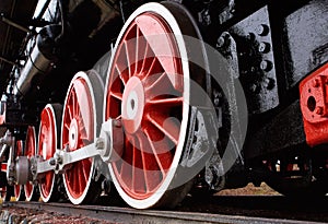 Red and white wheels of the old classic steam locomotive