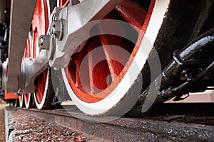 Red and white wheels of the old classic steam locomotive