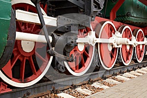 Red and white wheels of the old steam locomotive