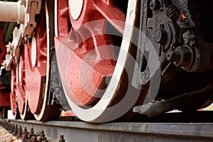Red and white wheels of the old steam locomotive
