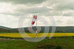 A red and white wind cone indicating the direction and strength of the wind