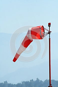 Red-white windsock at airport photo