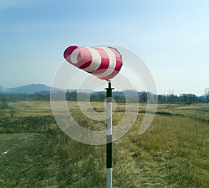 Red-white windsock indicating wind