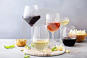 Red, white wine and rose in different glasses