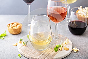 Red, white wine and rose in different glasses