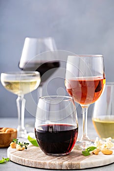 Red, white wine and rose in different glasses