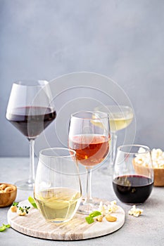 Red, white wine and rose in different glasses