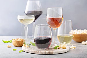 Red, white wine and rose in different glasses