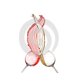 Red and white wine splashing from glass isolated