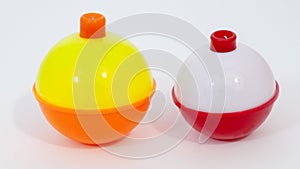 Red and white and yellow, orange day-glo fishing bobbers photo