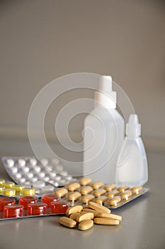 Pills and bottle on white background