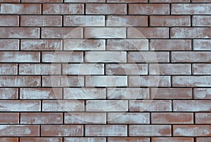 Red whitened weathered old brick wall background