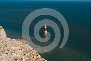 Red and whiteâ€“striped Beachy Head Lighthouse against chalk cliffs,  view from top of Seven Sisters, Clifftop Paths Nature