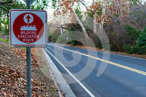 Red wildfire evacuation route sign