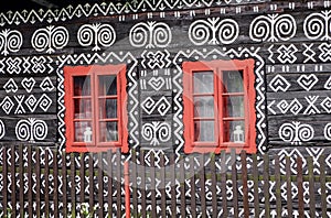 Red windows on rural ornamental house