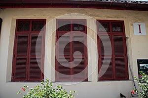 red windows with shutters