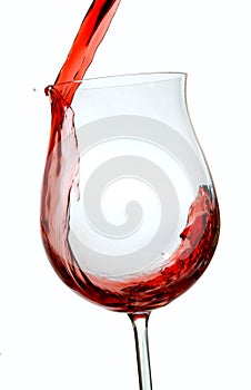 Red wine being poured into a wine glass