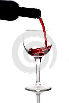 Red wine being pured into a wine glass