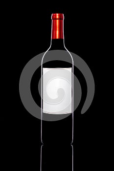 Red wine bottle  with blank label on black background holiday drink