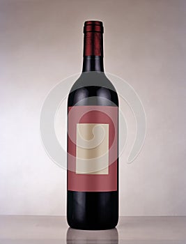 Red wine bottle from Bordeaux with blank label sticker