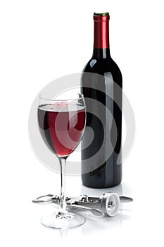 Red wine bottle, glass and corkscrew