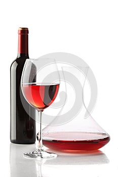 Red wine. A bottle, a glass and a decanter photo