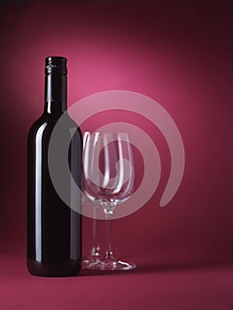 Red wine bottle and glasses with copy space