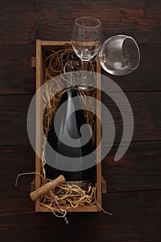 Red wine bottle, glasses, corkscrew, flat lay